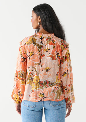 Bold floral coral blouse with ruffle neckline and flutter shoulder detail long sleeves feminine Manitoba Canada